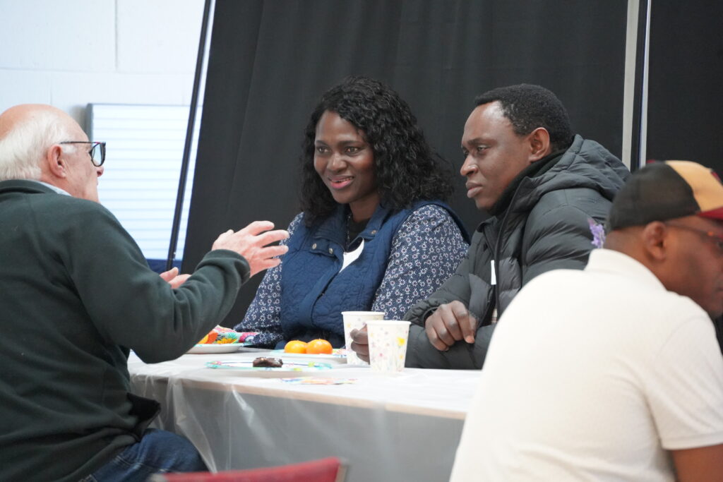 Group seated rapt in conversation.