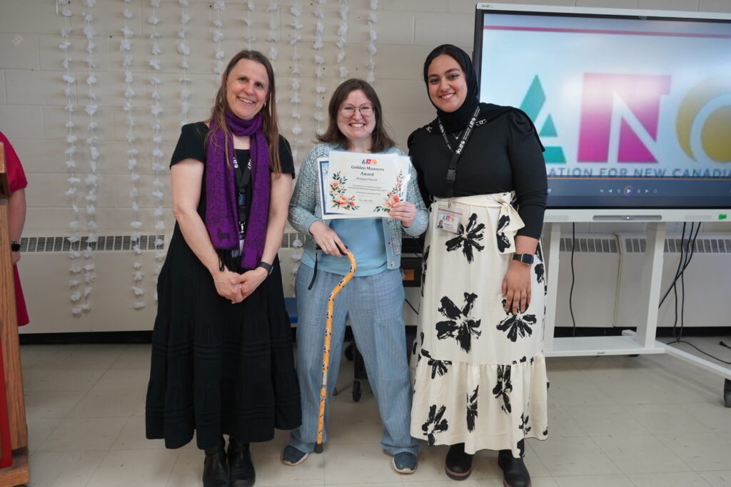 Three women standing.