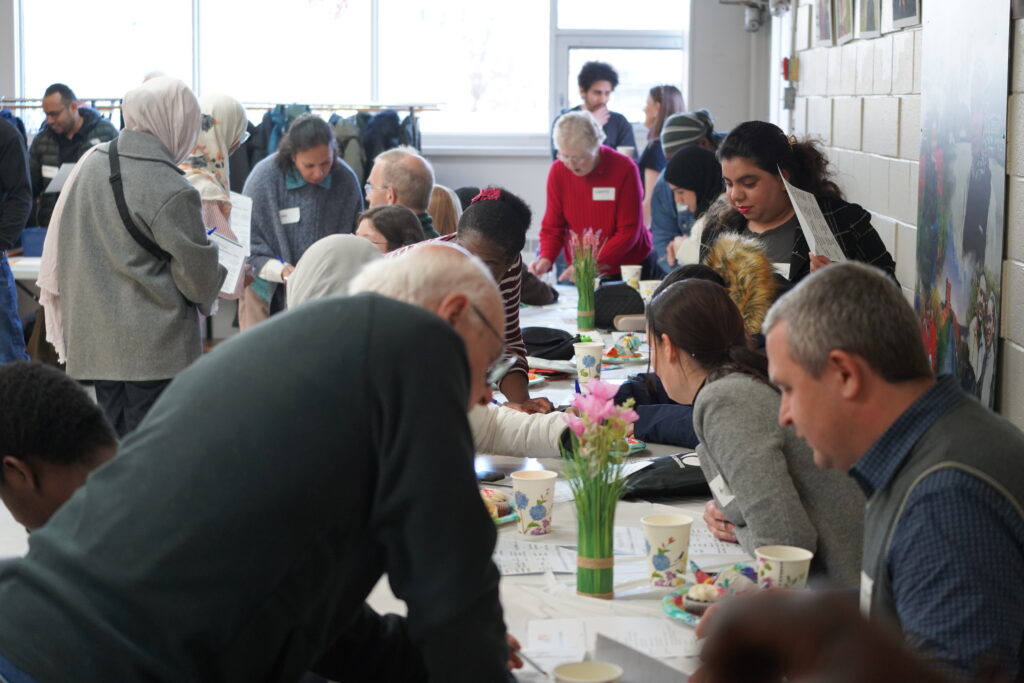 Volunteers at a long table. 